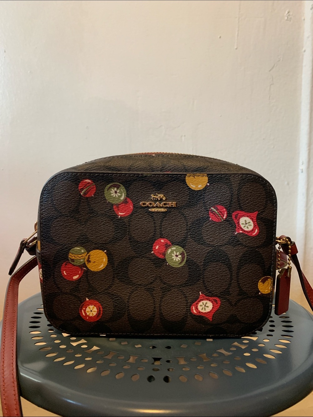 Coach Brown leather Crossbody Purse with Multicolor Bell Ornament design